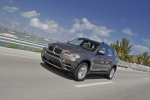 2013 BMW X5 xDrive35i in Sparkling Bronze Metallic - Driving Front Left Three-quarter View
